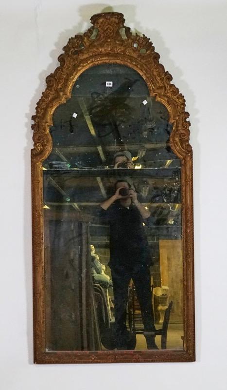 A Regence style gilt framed arch top mirror