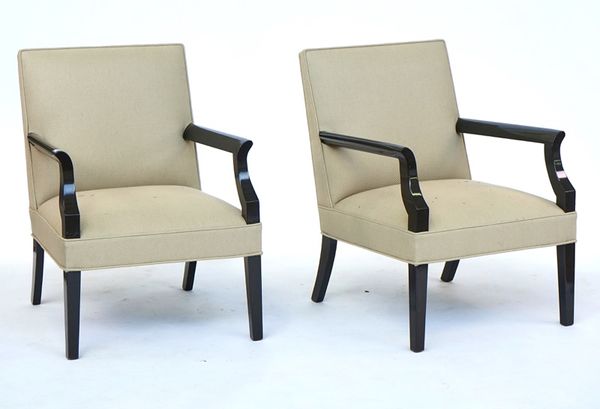 A pair of ebonised square back open armchairs