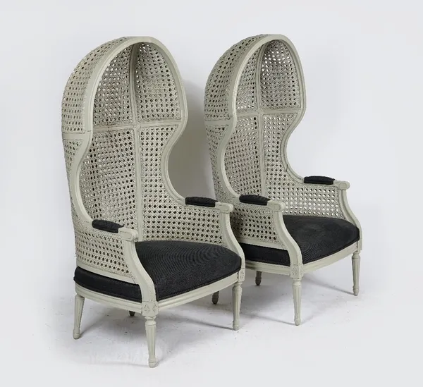 A pair of grey-painted double-caned porters’ chairs