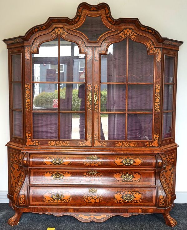 A Dutch style floral marquetry inlaid bonnet topped display cabinet chest