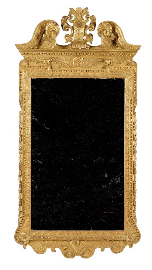 A George II style giltwood mirror with cartouche crest