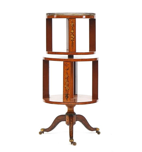 An Edwardian floral polychrome painted twin section revolving bookstand