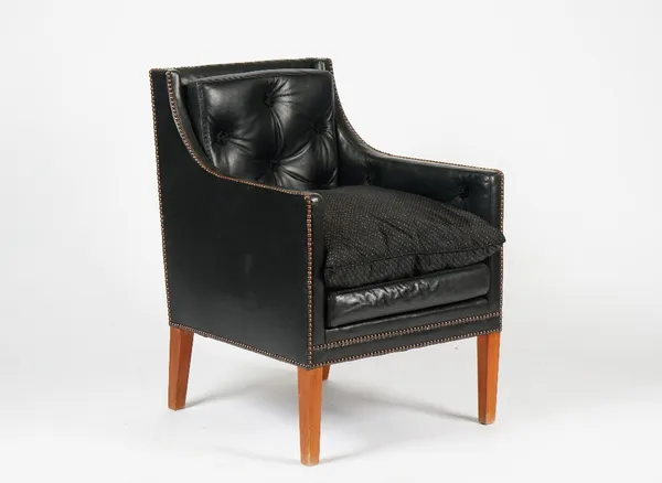 LINLEY; a green leather upholstered Nelson chair with buttoned tufting and a Linley branded cushion