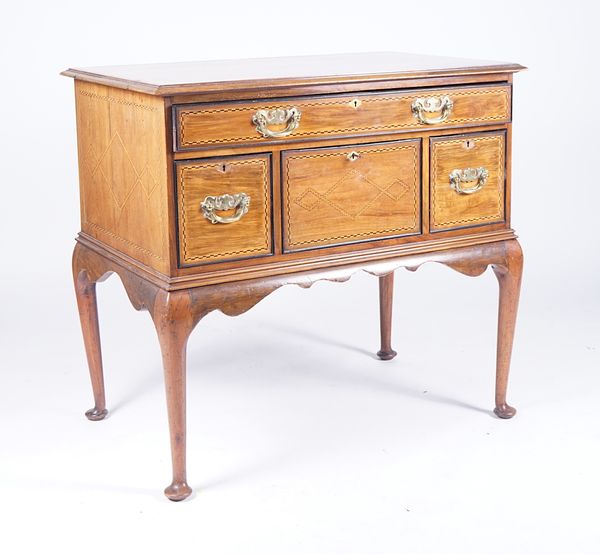 MAPLE AND CO.; AN 18TH CENTURY STYLE INLAID WALNUT LOWBOY