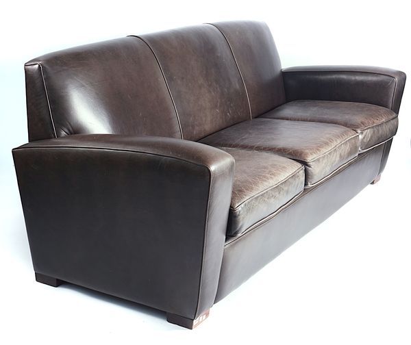 A MODERN TAN LEATHER UPHOLSTERED THREE SEAT SOFA