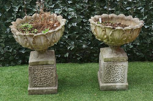 A PAIR OF RECONSTITUTED STONE LEAF MOULDED JARDINIERES (2)