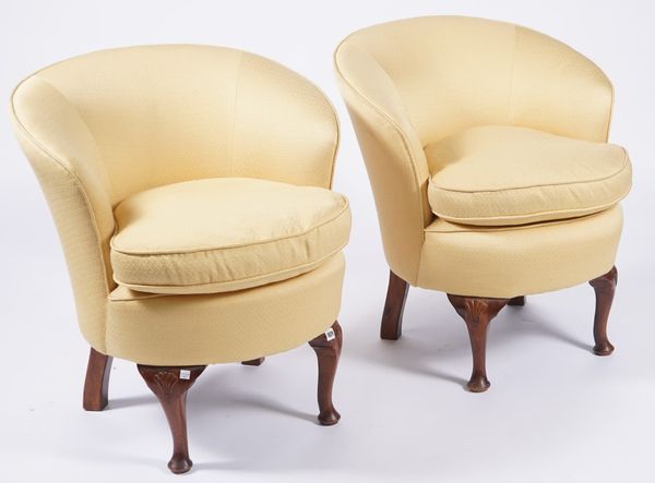 A PAIR OF YELLOW UPHOLSTERED TUB BACK EASY ARMCHAIRS (2)