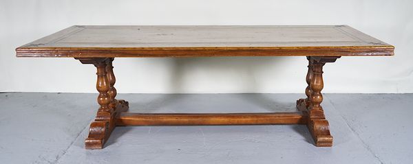 A 17TH CENTURY STYLE WALNUT EXTENDING REFECTORY DINING TABLE