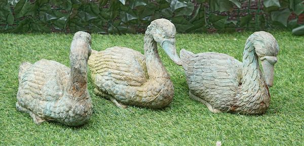 A SET OF THREE PATINATED BRONZE MODELS OF DUCKS (3)