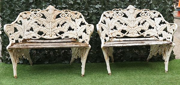 COALBROOKDALE; A PAIR OF WHITE PAINTED CAST IRON FERN AND BLACKBERRY PATTERN GARDEN BENCHES