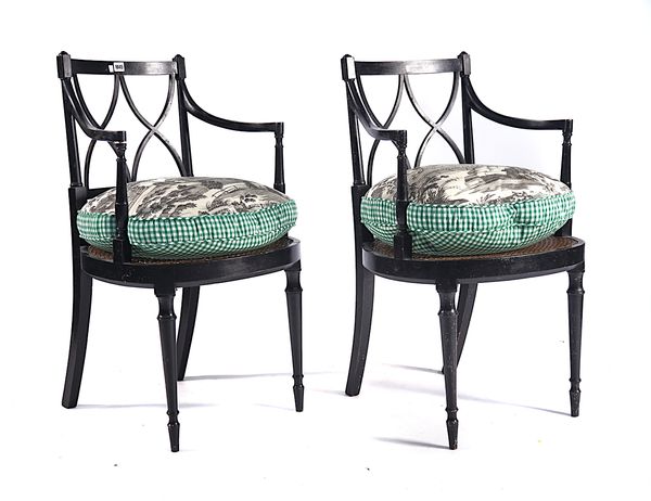 A PAIR OF REGENCY EBONISED LATTICE BACK OPEN ARMCHAIRS (2)