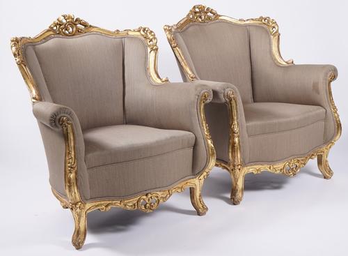A PAIR OF LOUIS XV STYLE GILT FRAMED TUB BACK ARMCHAIRS (2)