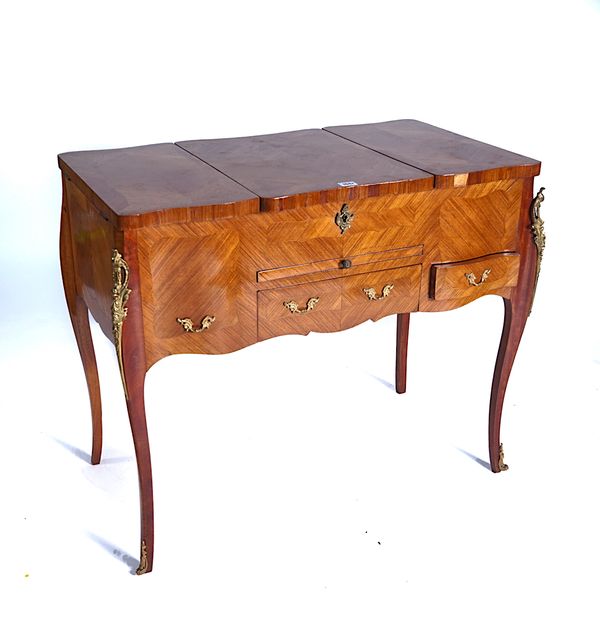 A LOUIS XV STYLE GILT-METAL MOUNTED KINGWOOD AND TULIPWOOD POUDREUSE OR DRESSING TABLE