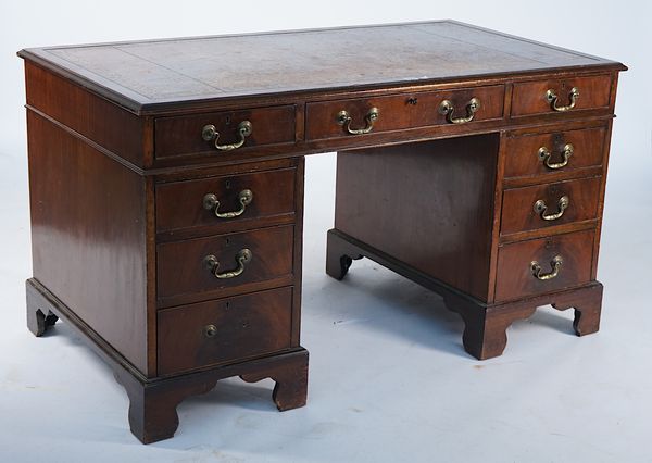 A GEORGE III STYLE MAHOGANY NINE DRAWER PEDESTAL DESK