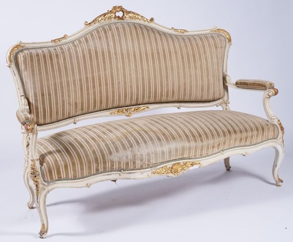 A LOUIS XV STYLE PARCEL GILT CREAM PAINTED THREE PIECE SALON SUITE (3)