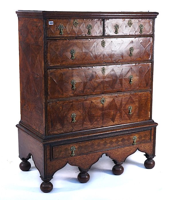 AN EARLY 18TH CENTURY PARQUETRY VENEERED OAK CHETST ON STAND