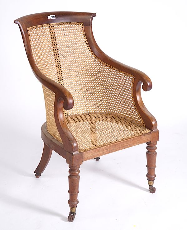 AN EARLY 19TH CENTURY MAHOGANY FRAMED TUB BACK LIBRARY CHAIR