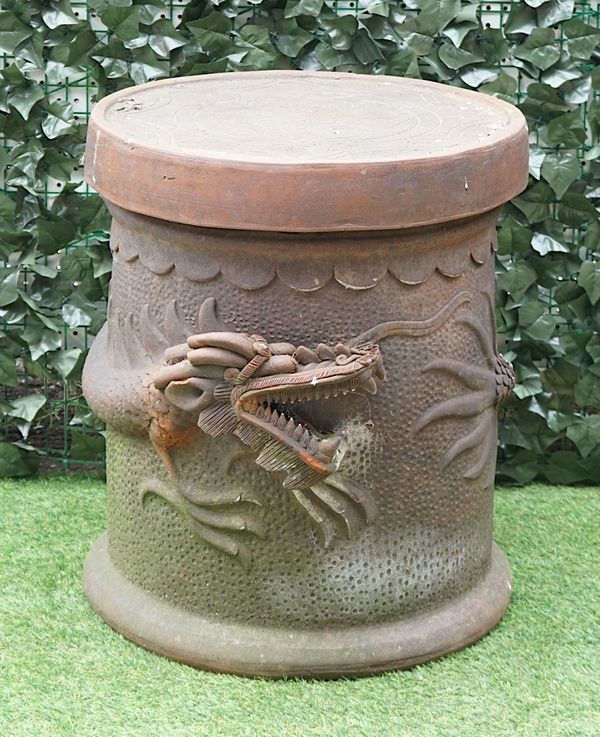 AN EASTERN TERRACOTTA CIRCULAR GARDEN TABLE, THE COLUMN RELIEF MOULDED WITH A DRAGON