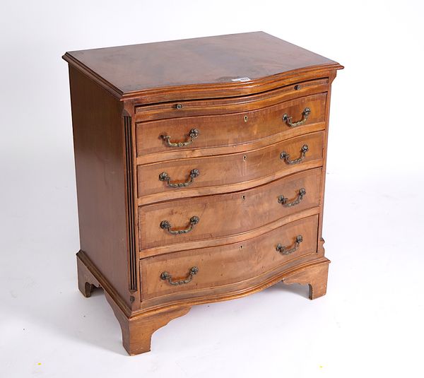 A GEORGE III STYLE SERPENTINE MAHOGANY CHEST