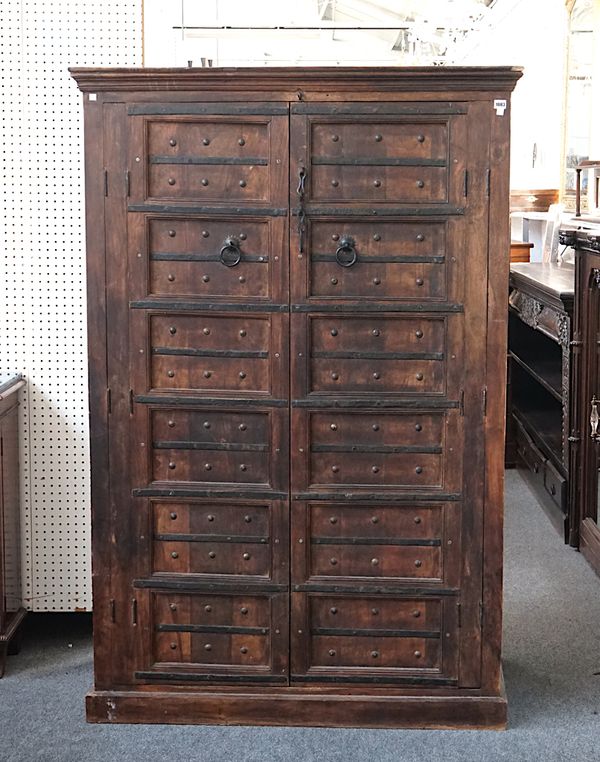 AN EARLY 20TH CENTURY INDIAN IRON BOUND HARDWOOD TWO DOOR CUPBOARD