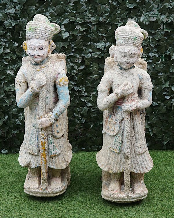 A PAIR OF ASIAN CARVED STONE TEMPLE FIGURES, WITH POLYCHROME PAINT DECORATION (2)