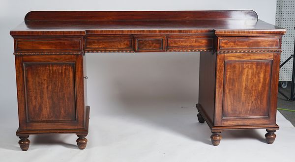 A WILLIAM IV MAHOGANY INVERTED BREAKFRONT TWIN PEDESTAL SIDEBOARD