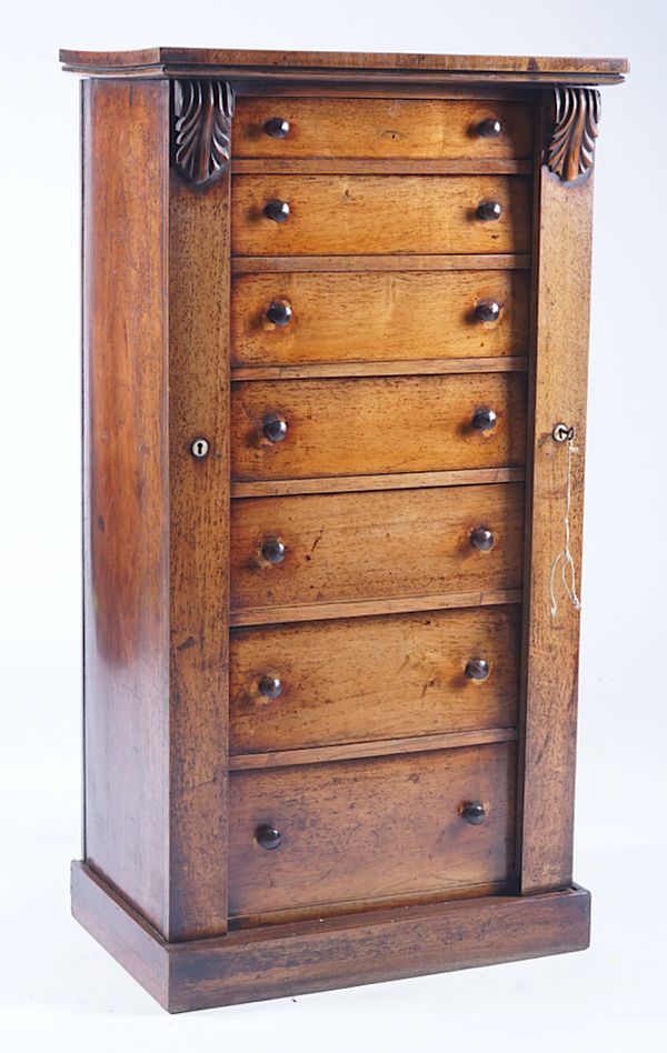 A VICTORIAN ROSEWOOD SEVEN DRAWER WELLINGTON CHEST