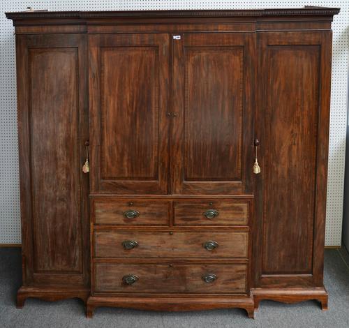 A GEORGE III CROSSBANDED MAHOGANY BREAKFRONT COMPACTUM WARDROBE