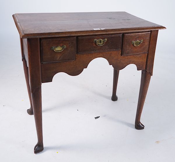 A MID-18TH CENTURY OAK THREE DRAWER LOWBOY