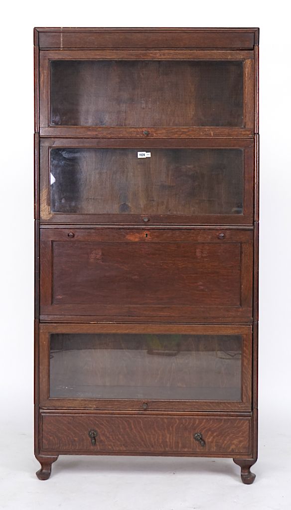 GLOBE WERNICKE; AN OAK FOUR TIER BOOKCASE, WITH FITTED SECRETAIR SECTION