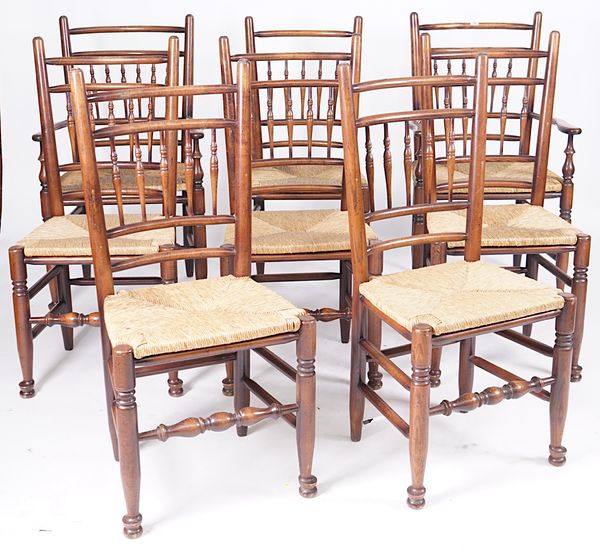 A SET OF EIGHT SPINDLE TURNED ASH FRAMED RUSH SEATED DINING CHAIRS (8)