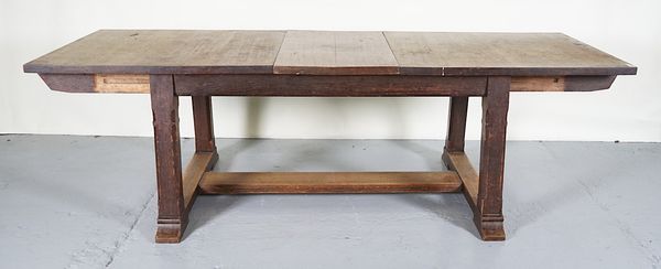 A VICTORIAN OAK GOTHIC REVIVAL DRAW LEAF EXTENDING DINING TABLE