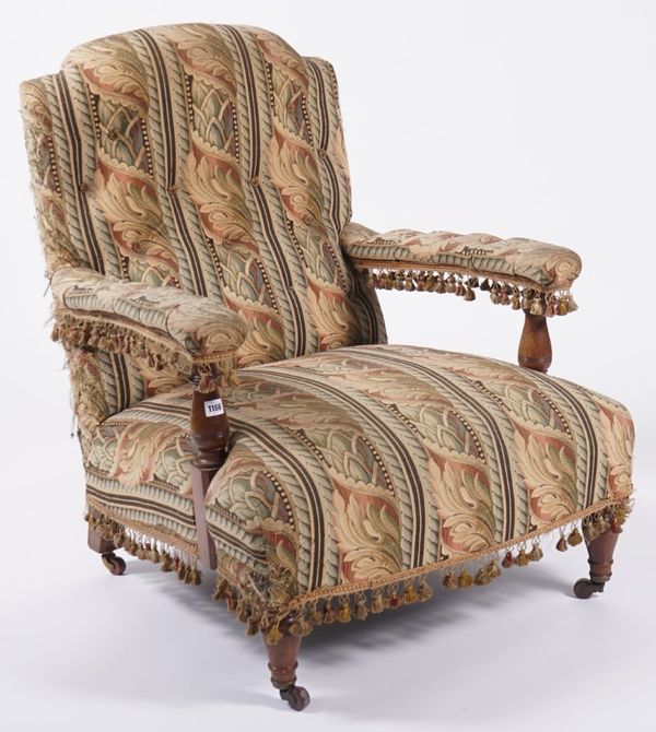 A VICTORIAN WALNUT FRAMED OPEN ARM EASY CHAIR