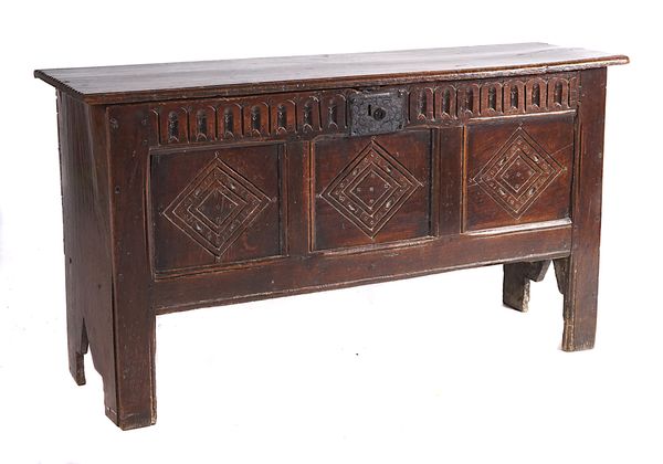 A 17TH CENTURY WITH CARVED TRIPLE PANEL FRONT