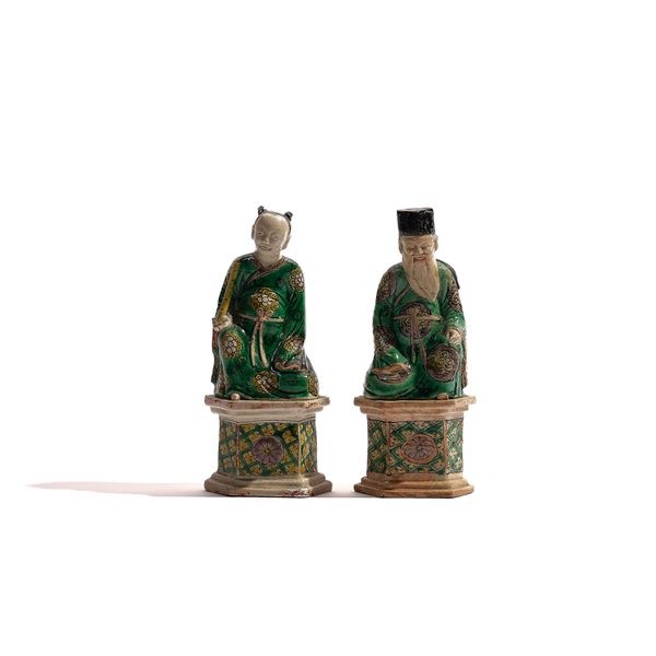 A PAIR OF CHINESE BISCUIT FIGURES OF THE DAOIST IMMORTALS HAN XIANG ZI AND CAO GUO-JIU