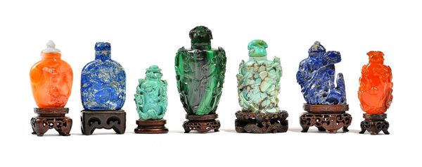 A GROUP OF SEVEN CHINESE HARDSTONE SNUFF BOTTLES