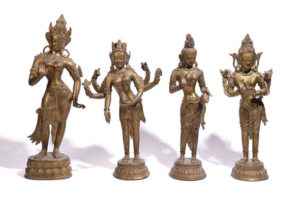 A GROUP OF FOUR BRASS FIGURES OF DEITIES OR CONSORTS (4)