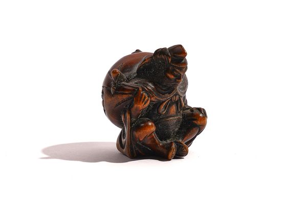 A JAPANESE WOOD NETSUKE OF SHOKI