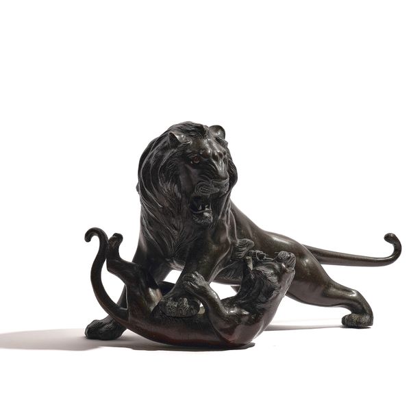 A JAPANESE BRONZE GROUP OF A LION ATTACKING A TIGER