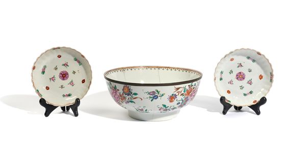 A CHINESE EXPORT FAMILLE-ROSE BOWL AND A PAIR OF SAUCERS (3)