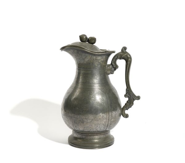 A CHINESE ENGRAVED PEWTER JUG AND COVER