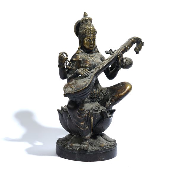 AN INDIAN BRONZE FIGURE OF SARASWATI