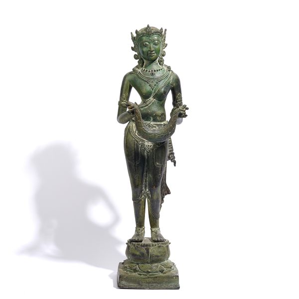 A TALL JAVANESE STYLE GREEN PATINATED BRONZE FIGURE OF A DEITY