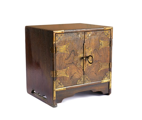 A CHINESE SMALL WOODEN TABLE CABINET WITH ENGRAVED BRASS MOUNTS