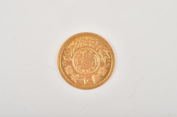 A JEWELLER'S COPY OF A SAUDI ARABIA GOLD COIN