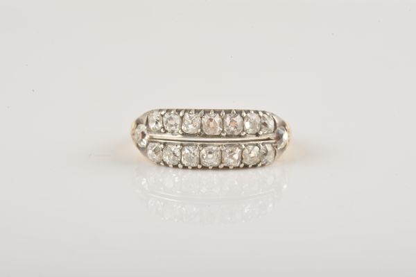 A GOLD AND SILVER SET DIAMOND RING