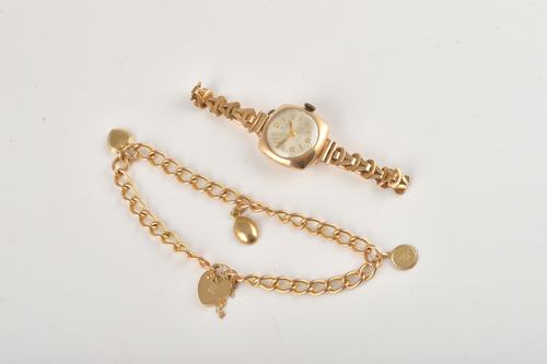 A LADY'S GOLD BRACELET WRISTWATCH AND A GOLD CHARM BRACELET (2)