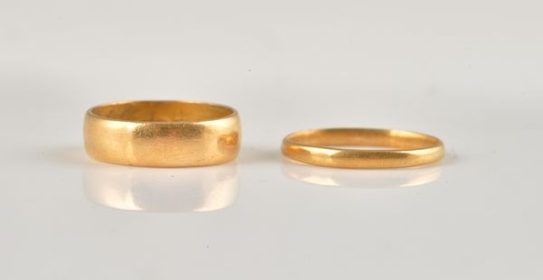 TWO 22CT GOLD WEDDING RINGS (2)