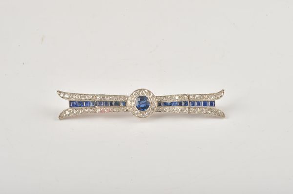A PLATINUM AND GOLD, SAPPHIRE AND DIAMOND BROOCH