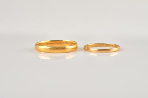 TWO 22CT GOLD WEDDING RINGS (2)
